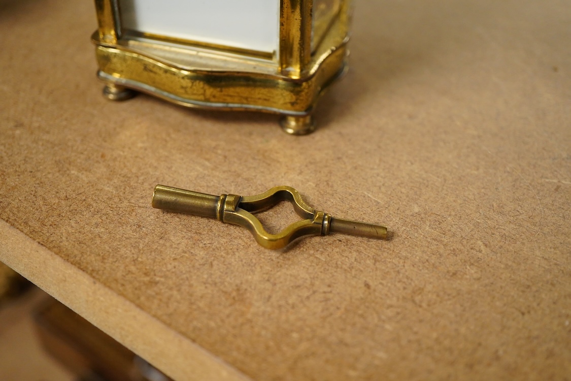 An early 20th century French gilt brass four glass carriage timepiece with key, 15cm high